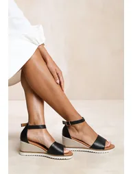 DUSK WEDGE SHOES WITH BUCKLE ANKLE STRAP IN BLACK PU