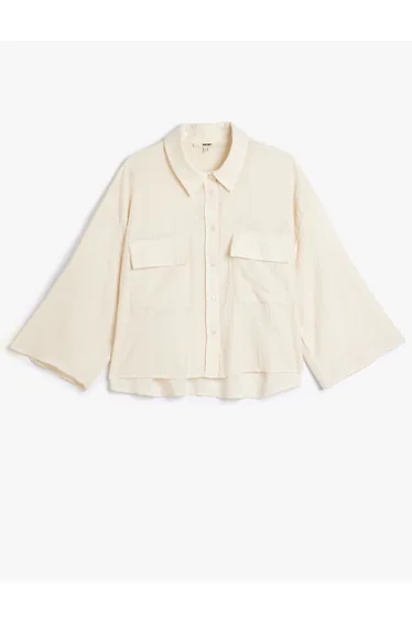 قميص  بلون كريمي بأكمام طويلة