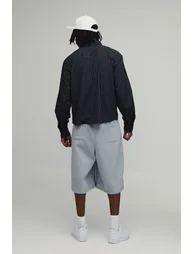 قميص مخطط بتصميم واسع عريض بحافة منحنية بتطريز لون أسود - لطويل القامة