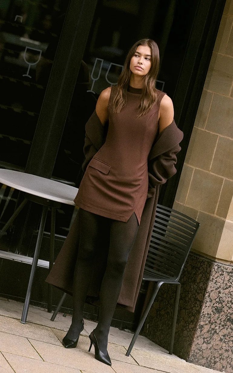 tights with bodycon dress 11 Fashionable Ways to Style Black Tights With a Dress, According to Fashion Editors
