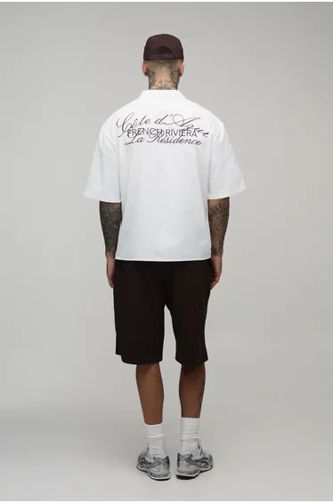 قميص قطن أبيض بأكمام طويلة