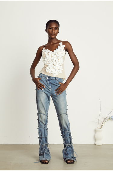 Géraldine strap-detail jeans