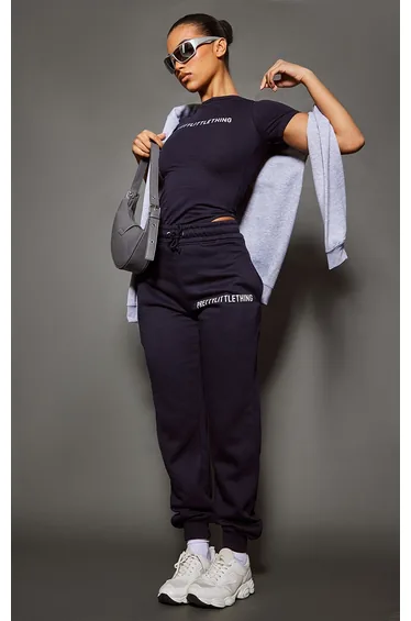 بنطلون رياضي بخصر عالي بحواف ضيقة بطبعة شعار - كحلي 