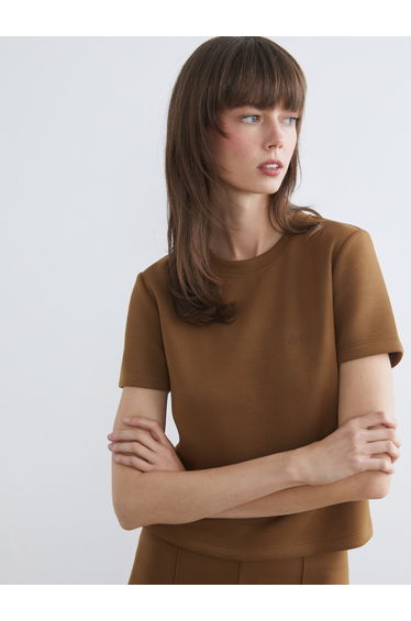 Embroidered soft-touch crew neck tee.