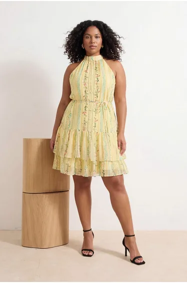فستان ترينديول كيرف أصفر قصير على شكل حرف A بياقة هالتر بطبعة أزهار
