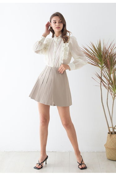 Crystal Chain Decorated Pleated Flap Mini Skirt in Sand