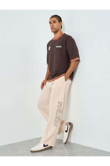 Men Beige Graphic Print Oversized Joggers