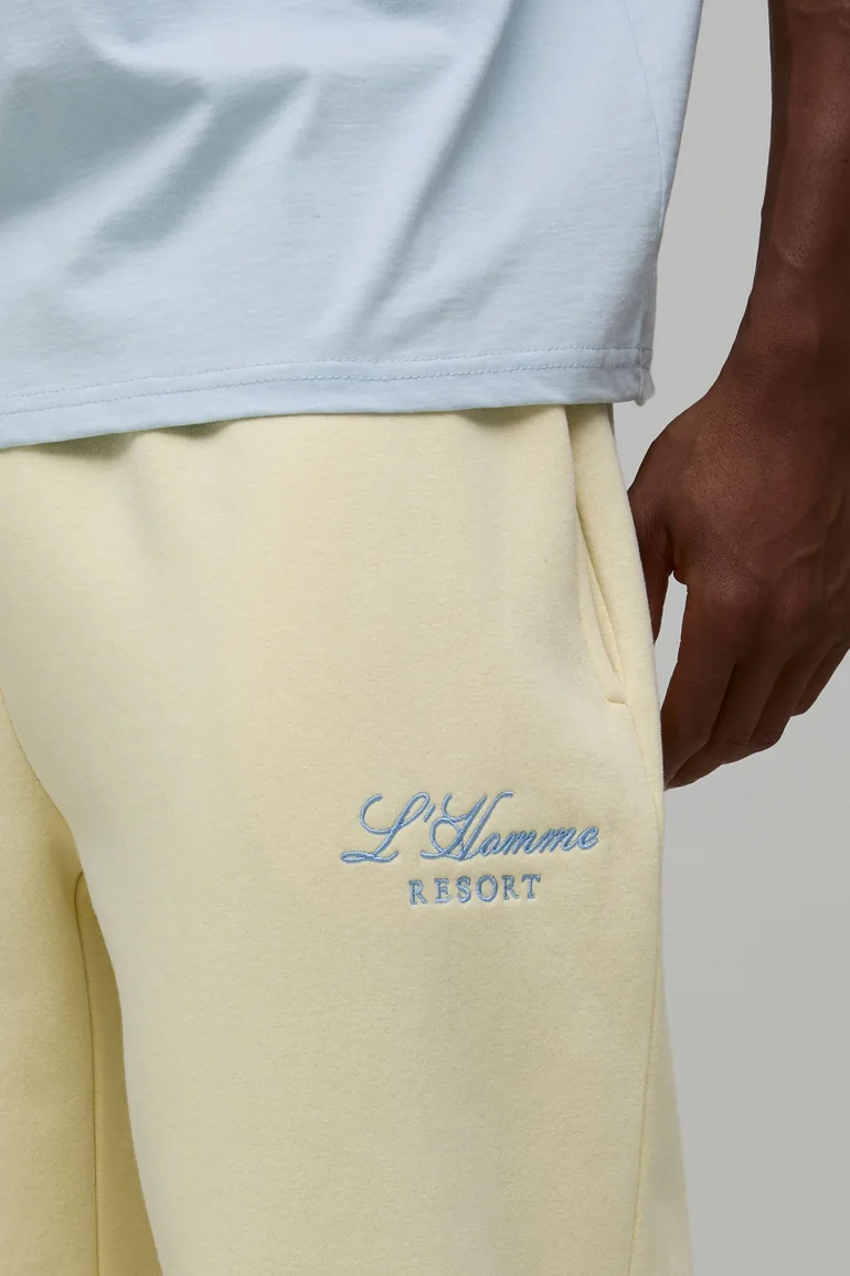 بنطلون رياضي بأرجل عريضة بشعار مطرز - أصفر - 2