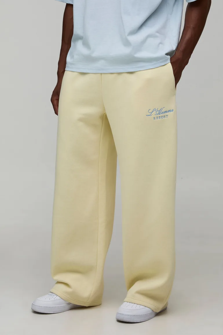 بنطلون رياضي بأرجل عريضة بشعار مطرز - أصفر