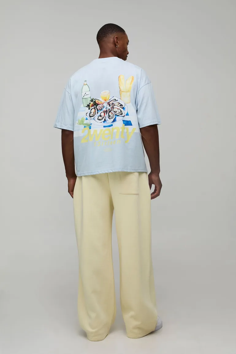 بنطلون رياضي بأرجل عريضة بشعار مطرز - أصفر - 1