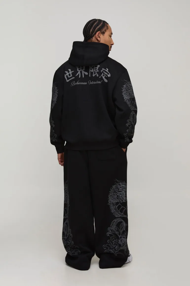 بنطلون رياضي بأرجل عريضة بطبعة غرافيك - أسود - 1