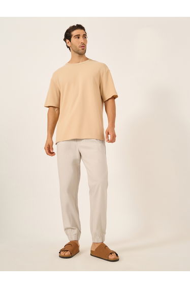 Solid Relaxed Fit Elasticated Cuffed Joggers with Drawstring