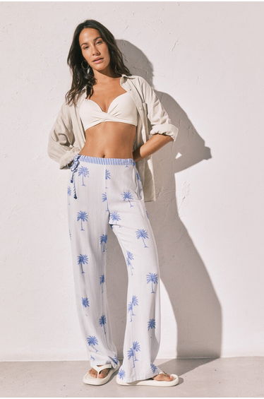 Long trousers with palm tree stripe print