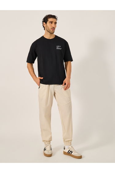 Solid Relaxed Fit Elasticated Cuff Joggers with Contrast Zip detail