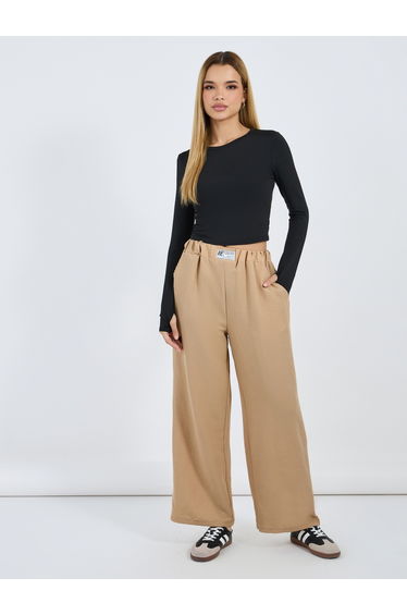 Textured Mid Rise Wide Leg Pants with Badge Detail