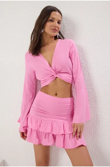 طقم بحر تنورة و بلوزة بكشكش لون زهري