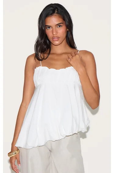 بلوزة كتان منفوخة بحمالات رفيعة لون أبيض