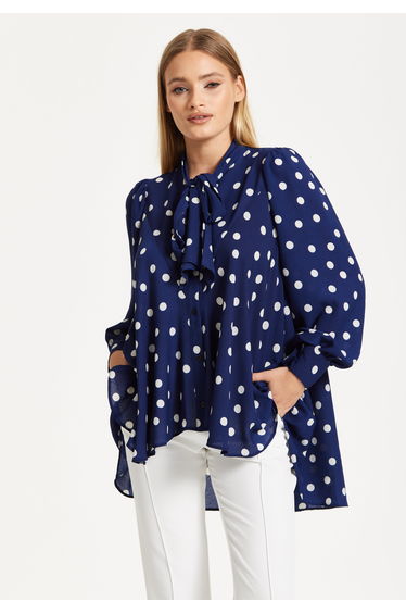 Navy Polka Dot Flared Hem Blouse