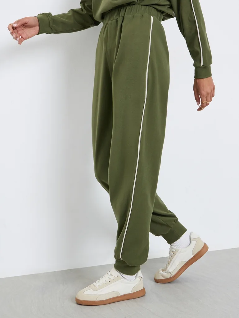 Women Green Plain Relaxed Fit Joggers with Piping Detail - 1