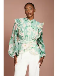 بلوزة أورجانزا بأكمام طويلة كشكش بطبعة - 1