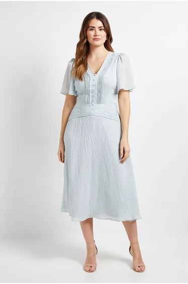 فستان ميدي بدرزات بارزة بأزرار