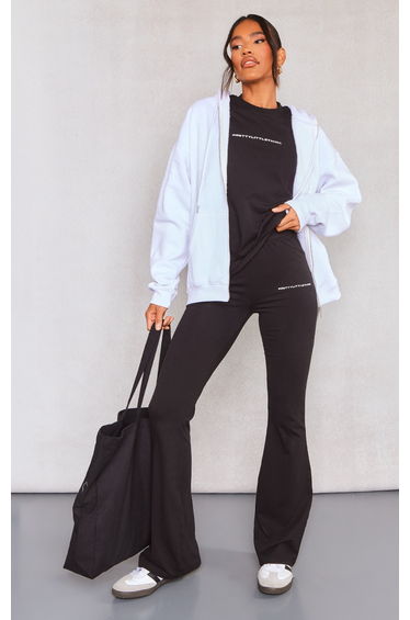 PRETTYLITTLETHING Black Printed Flared Trousers