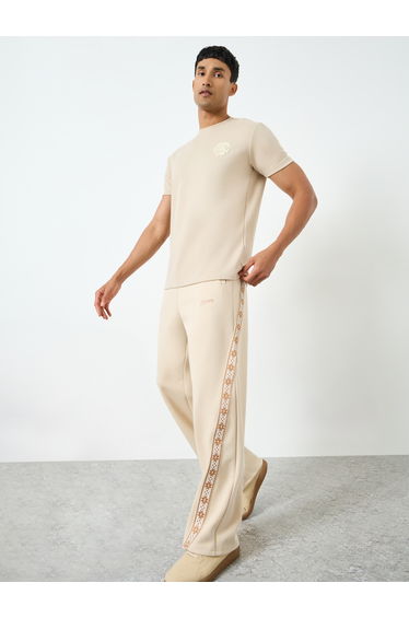 Men Beige Side Taping Print Oversized Joggers