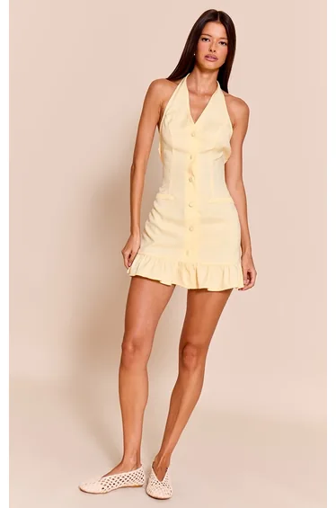 فستان بأزرار بحواف كشكش لون أصفر