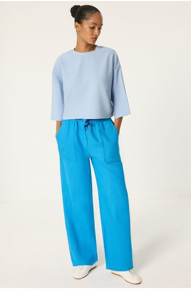 Linen trousers with elastic waistband and pockets