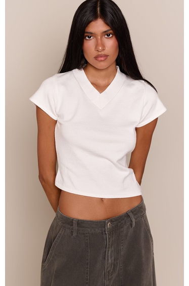 White Short Sleeve High V Neck Asymmetric Knitted Top