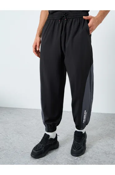 Men Black Placement Print Regular Fit Track Pants with Side Panel
