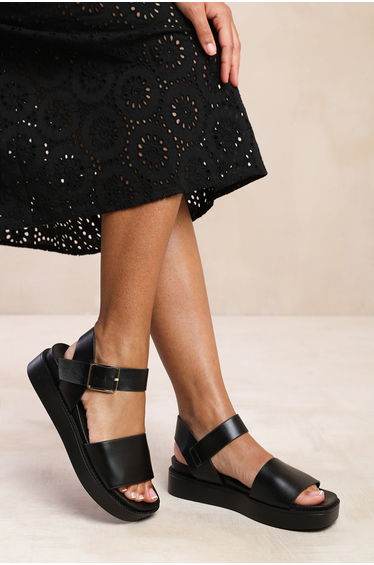 PHOENIX WIDE FIT CLASSIC FLAT SANDALS WITH STRAP AND BUCKLE DETAIL IN BLACK FAUX LEATHER